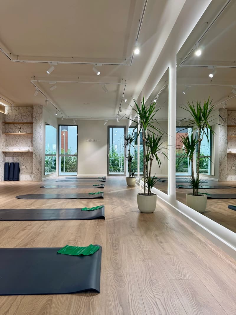 Bright Mat Room with mats laid out and floor-to-ceiling windows